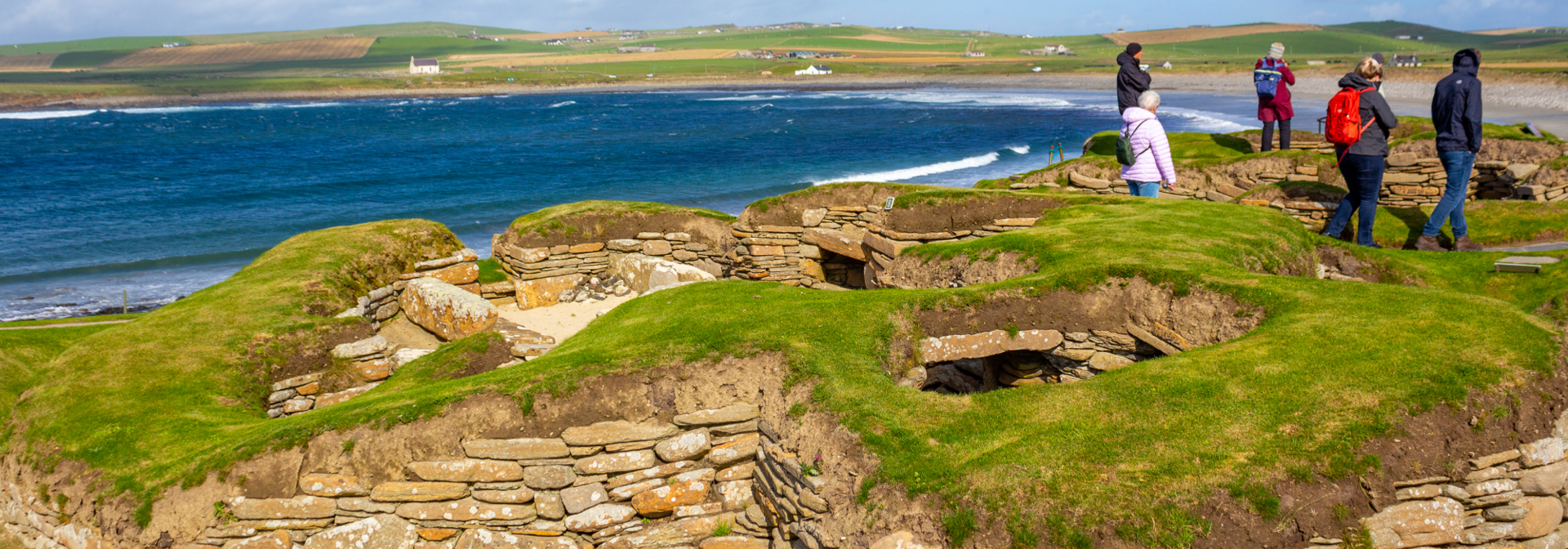 An ancient ruin sat beside a long coastline