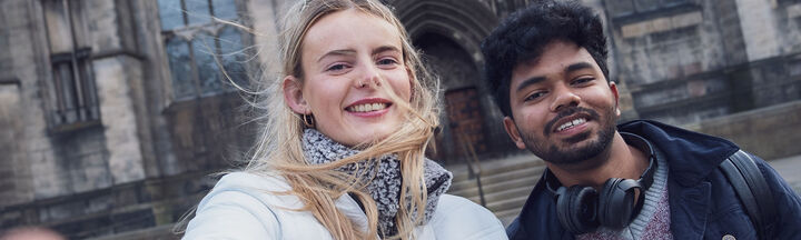 Two Heriot-Watt students take a 'selfie' outside St Giles Cathedral in Edinburgh