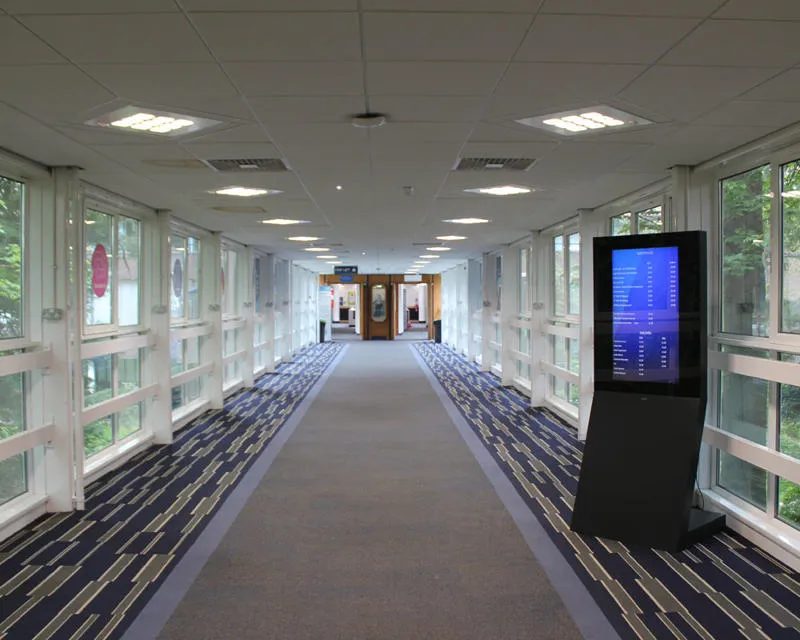 The Bridge Link connects the James Watt Centre to the Hugh Nisbet Building Long carpeted walkway with windows along both sides