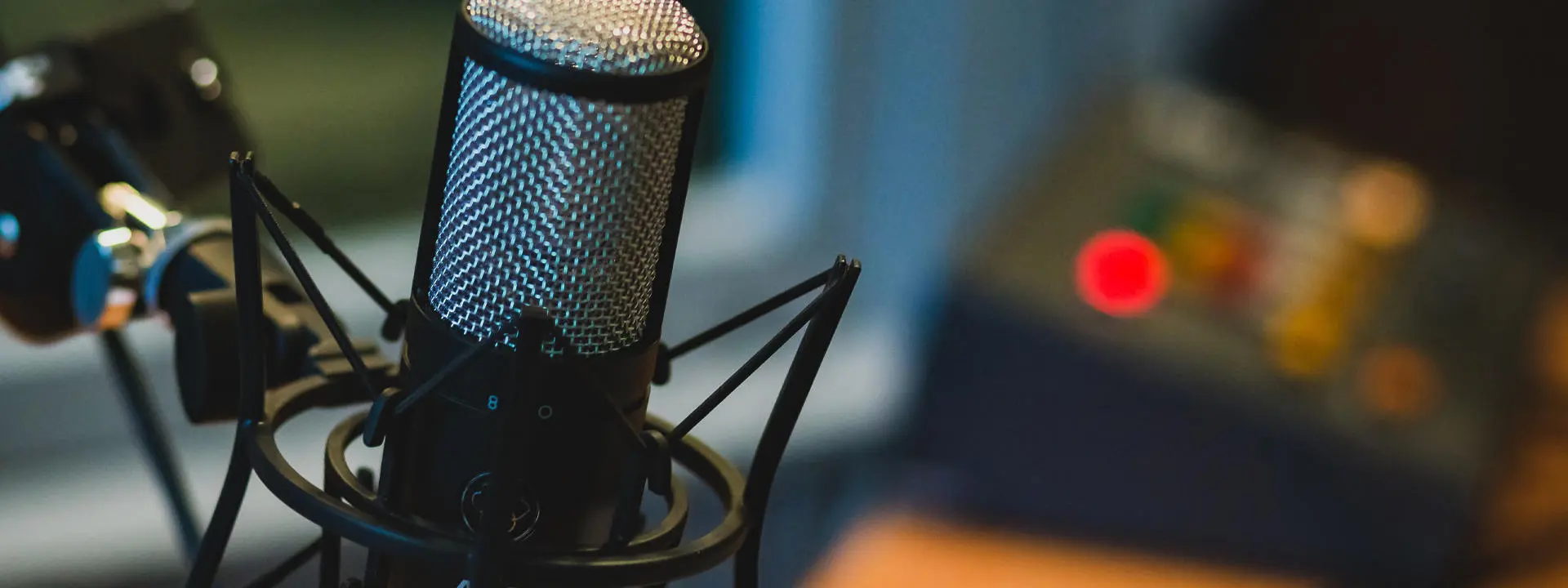 Close up of a microphone and recording equipment.
