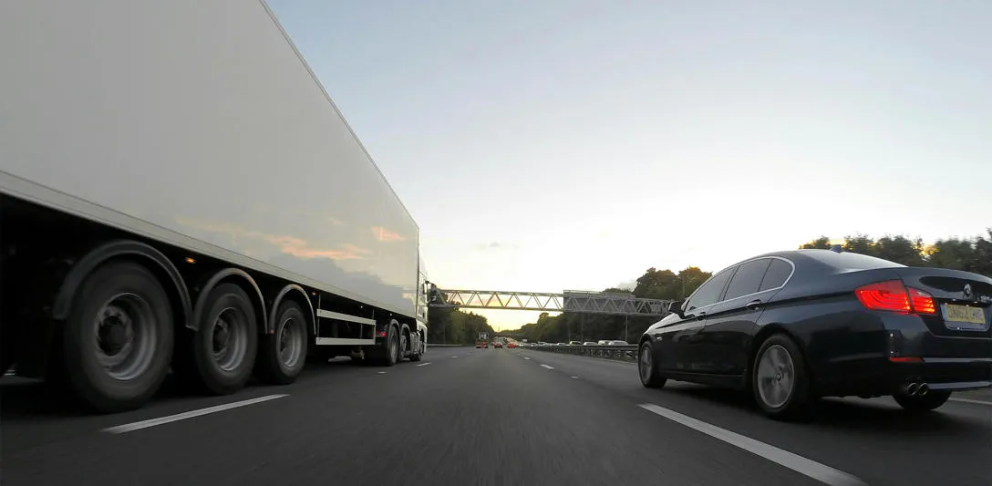 A truck and car on a motorway. Photo by Mike Bird, Pexels. A truck and car on a motorway. Photo by Mike Bird, Pexels.