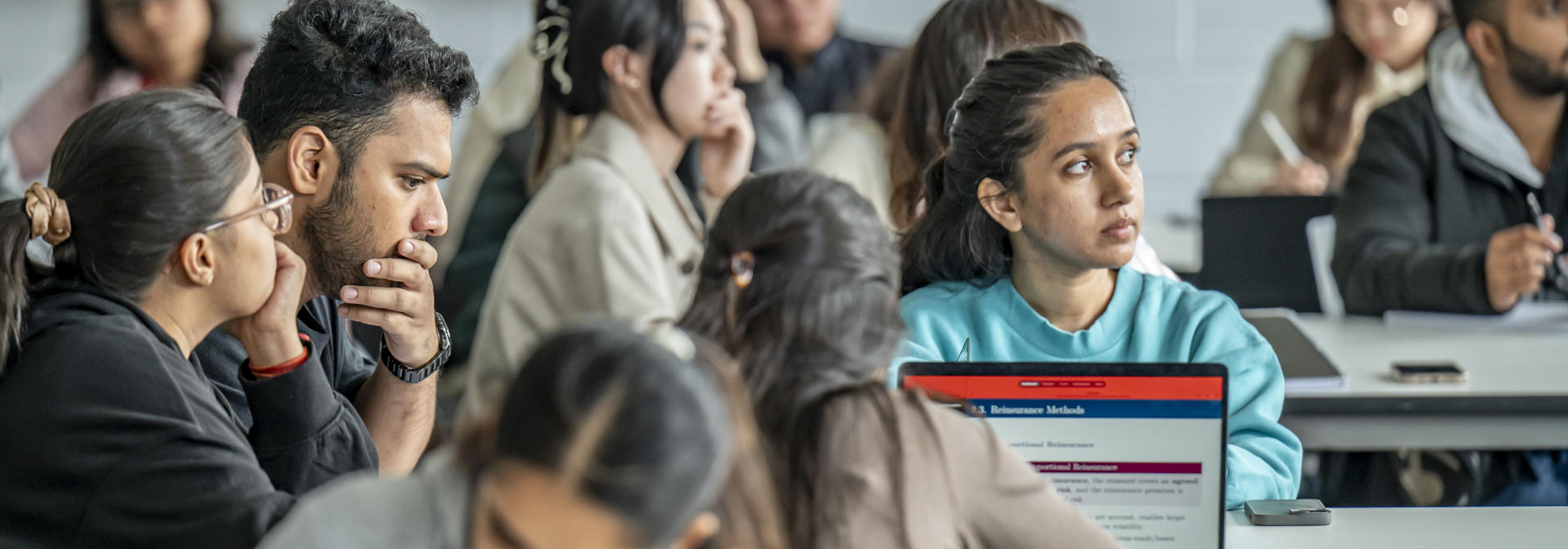 Students having a lecture in classroom
