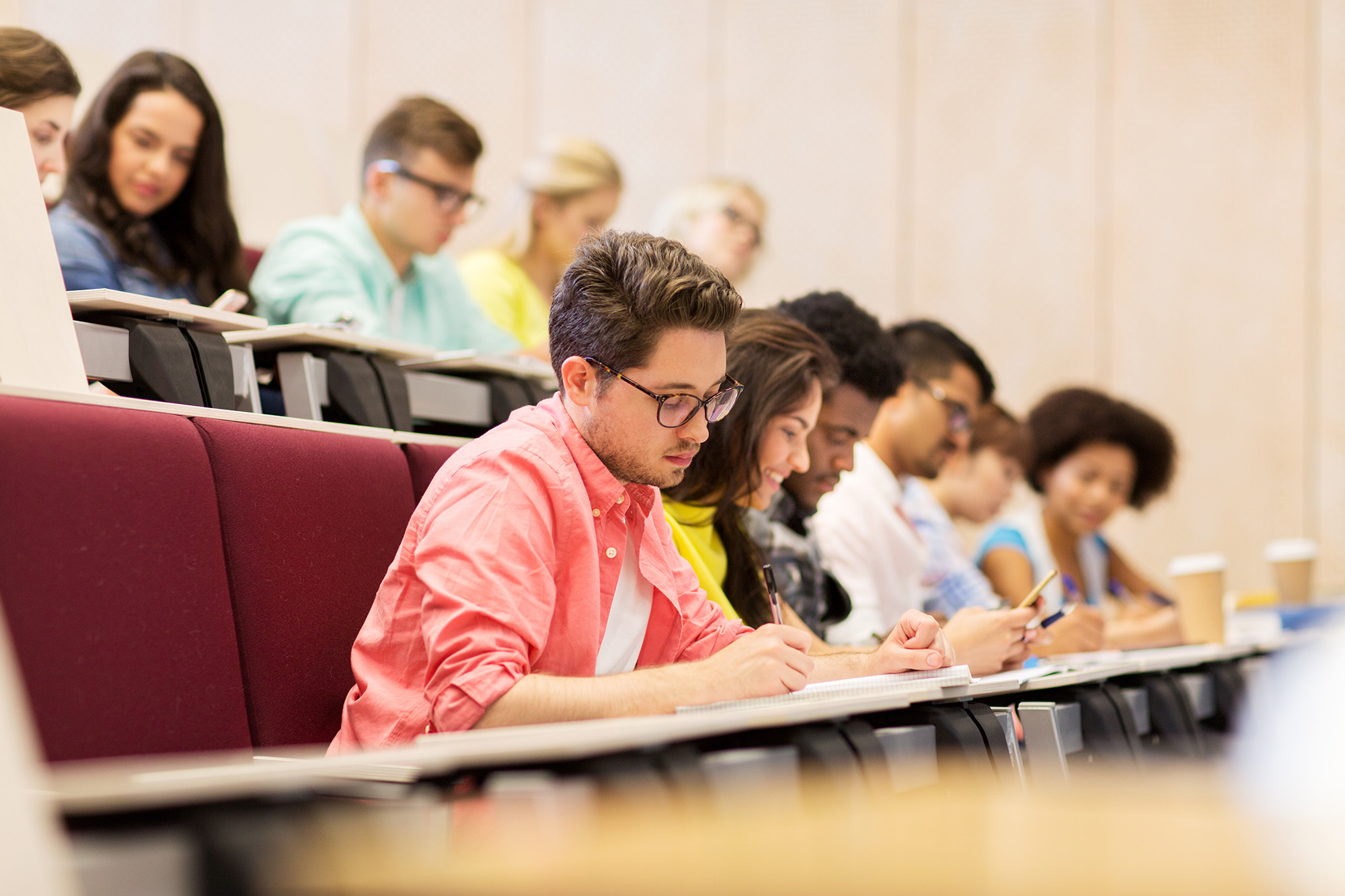 Students in a lecture taking notes