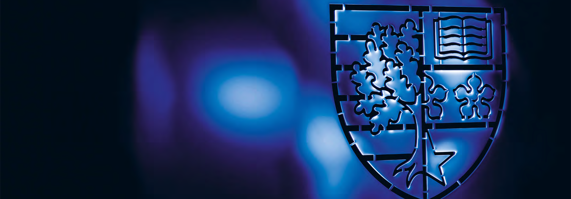 The Heriot-Watt shield on a blue background